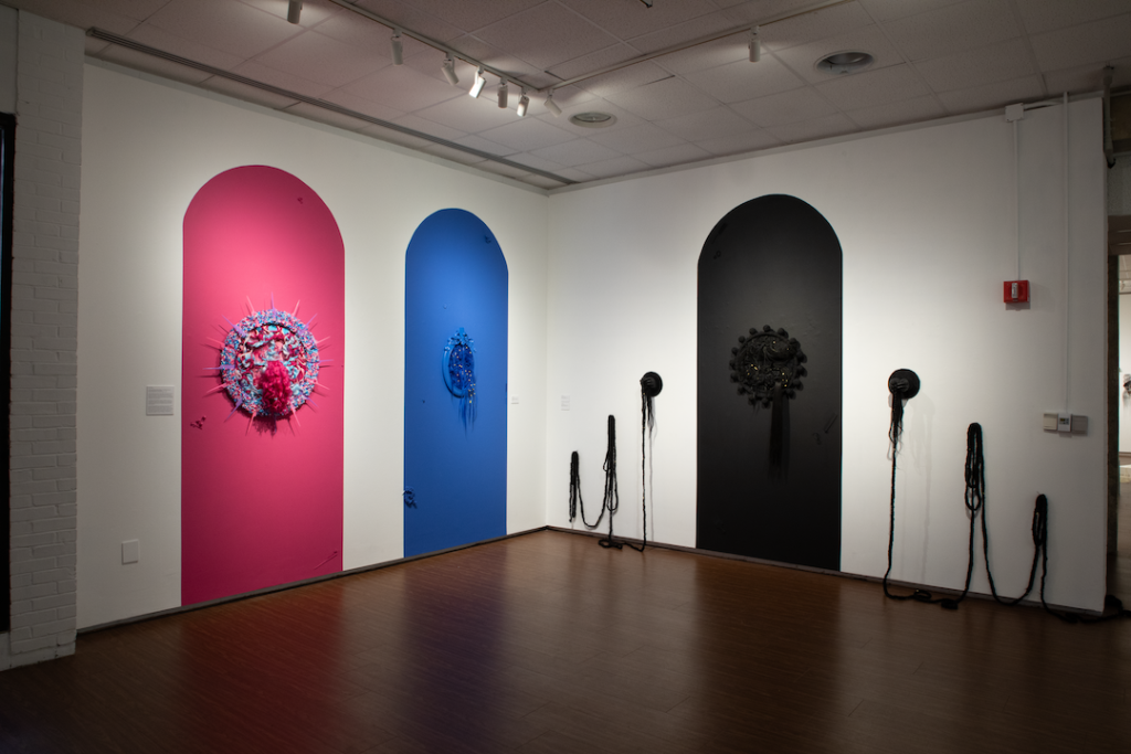 there is a room with three different colored doors and a clock on the wall