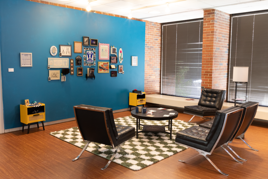 this is an image of a living room with a checkered floor and blue walls