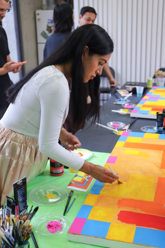 A young woman painting